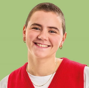 Image of a short haired women with a bright redt tank top and a green background