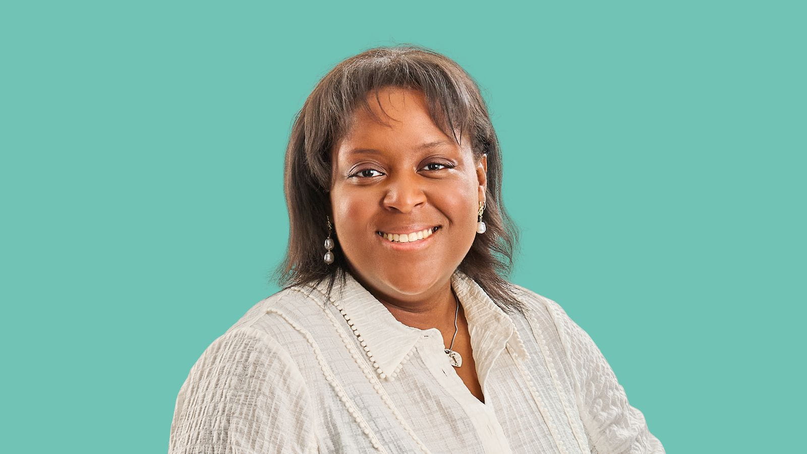 Image of a woman with a white buttoned linen shirt and a blue background