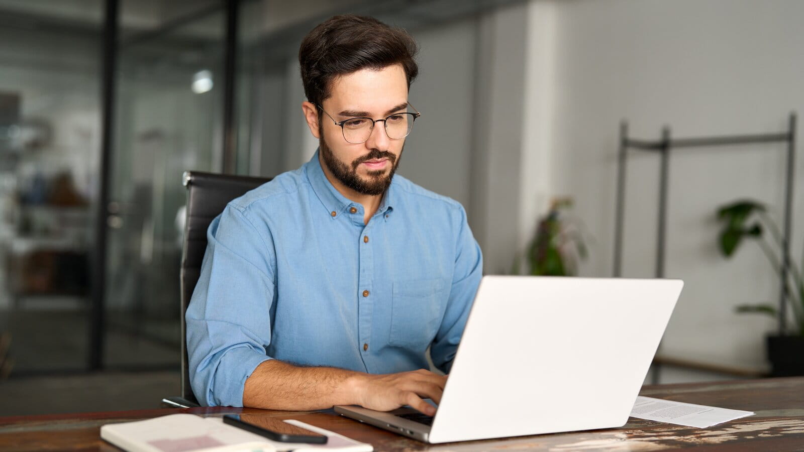 Man working on laptop in office