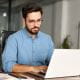 Man working on laptop in office