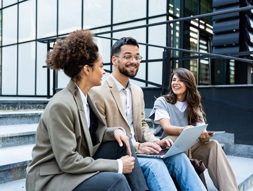 Image of people sitting on steps smiling