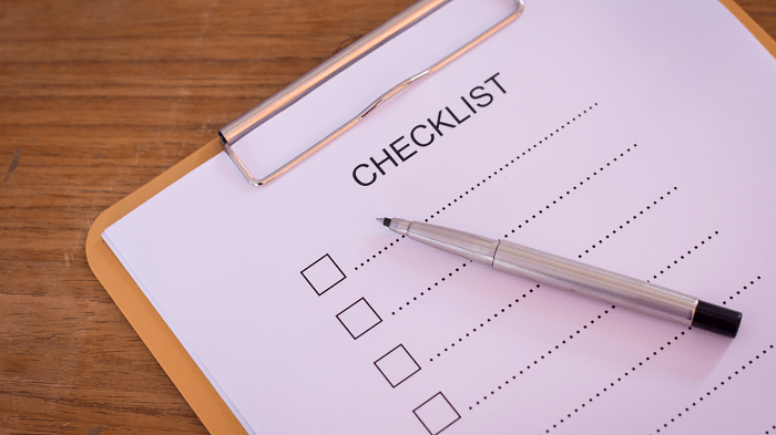 Lightbulb in forest with plant growing inside