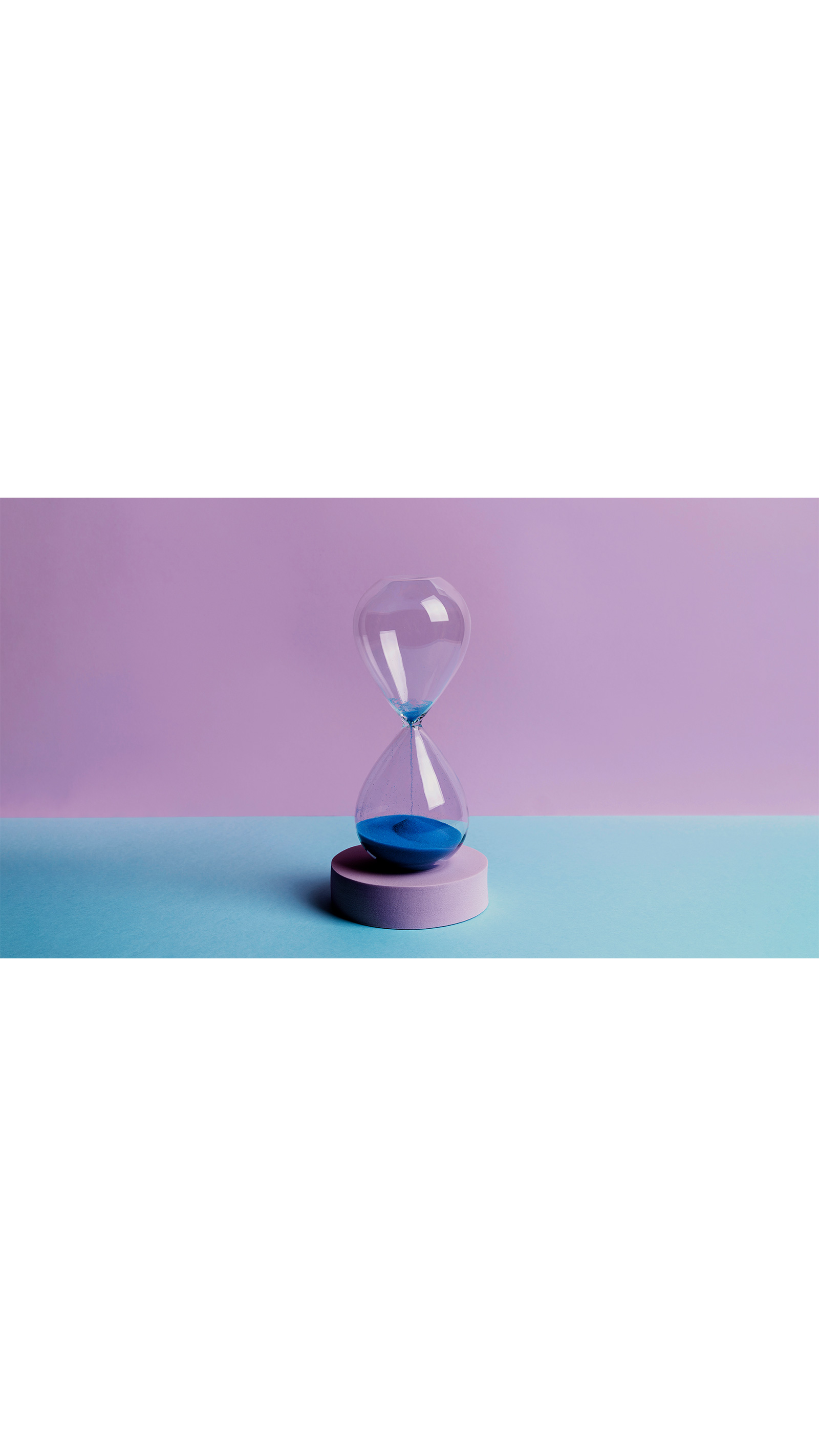 sand timer glass on platform blue sand purple background
