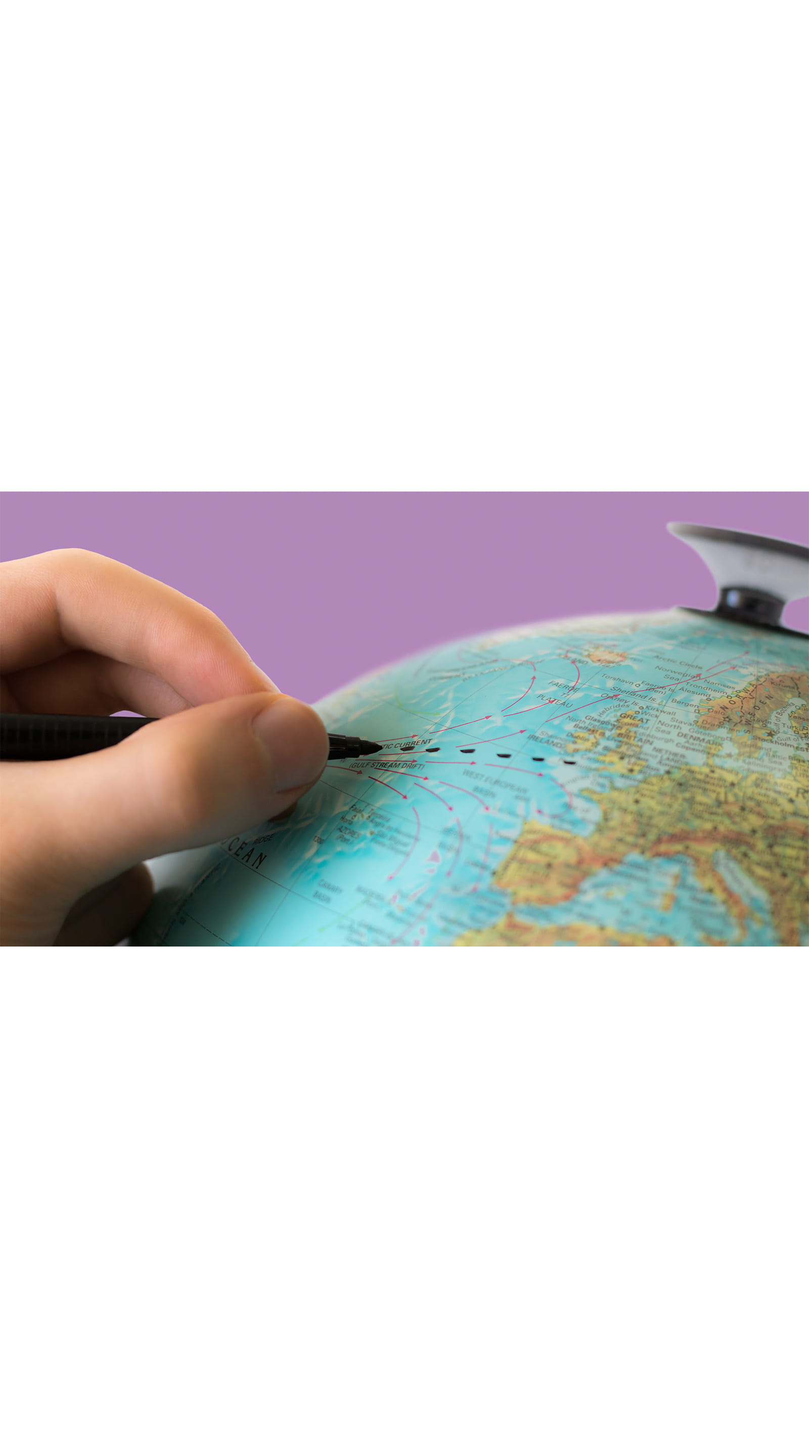 Hand drawing lines dots on the globe with a black permanant marker purple background