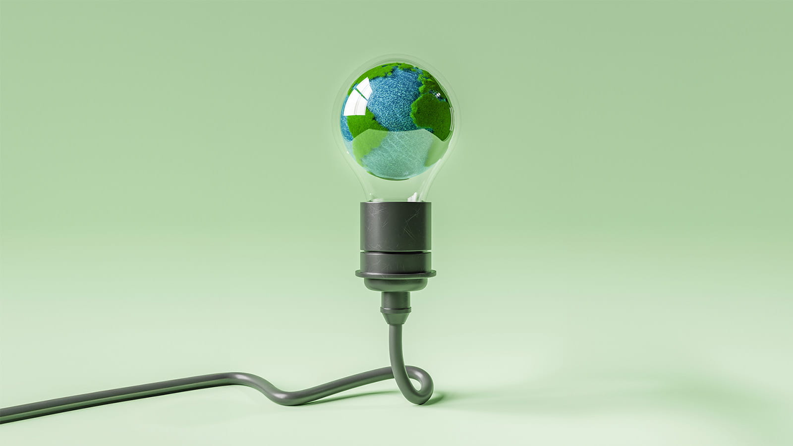 illustration of a felt globe planet earth blue green inside of a glass light bulb
