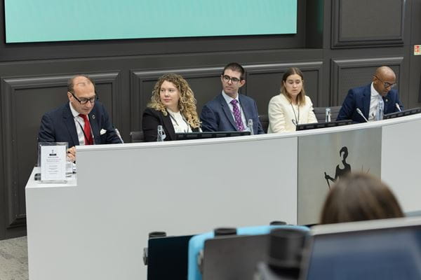 Photo of professionals on an event panel