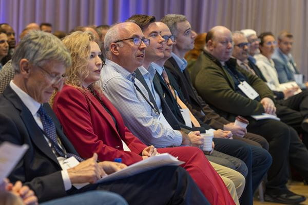 Photo of people in the audience of an event speach