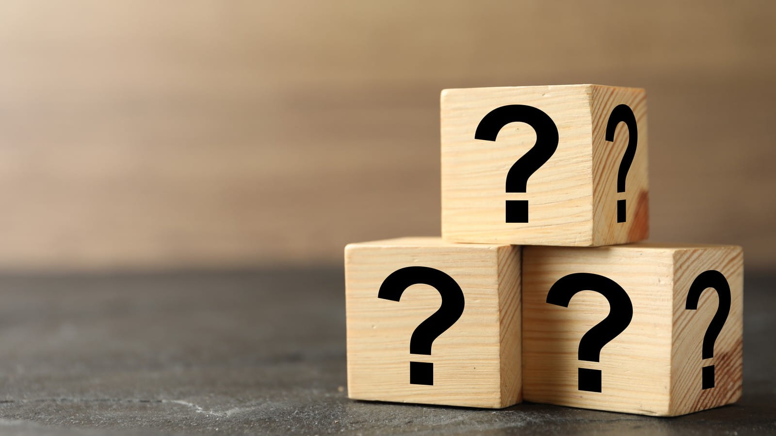 Five question marks on blocks