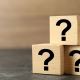 Five question marks on blocks