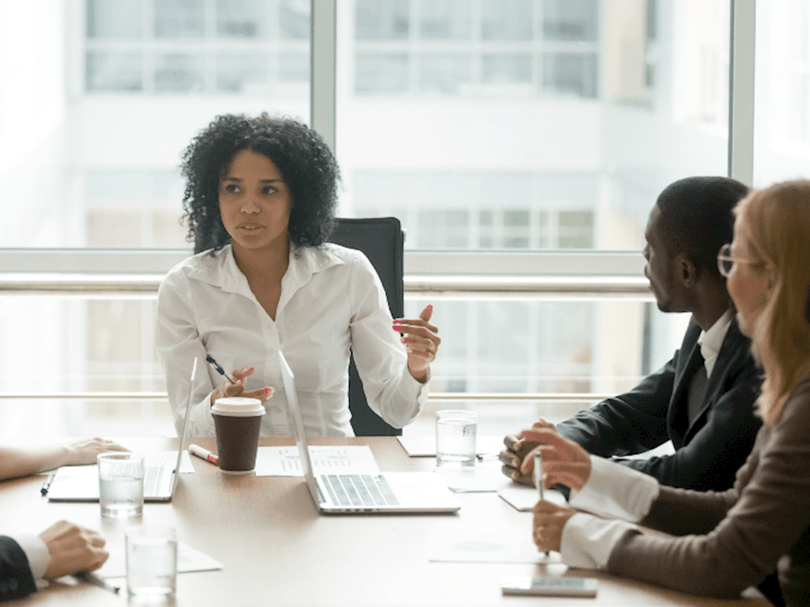 Black woman chairing meeting