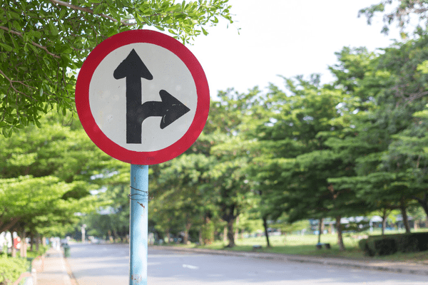 Road sign pointing ahead