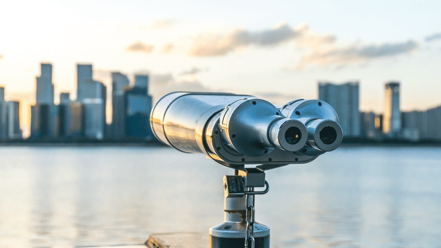 Telescope viewer with city skyline