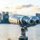 Telescope viewer with city skyline