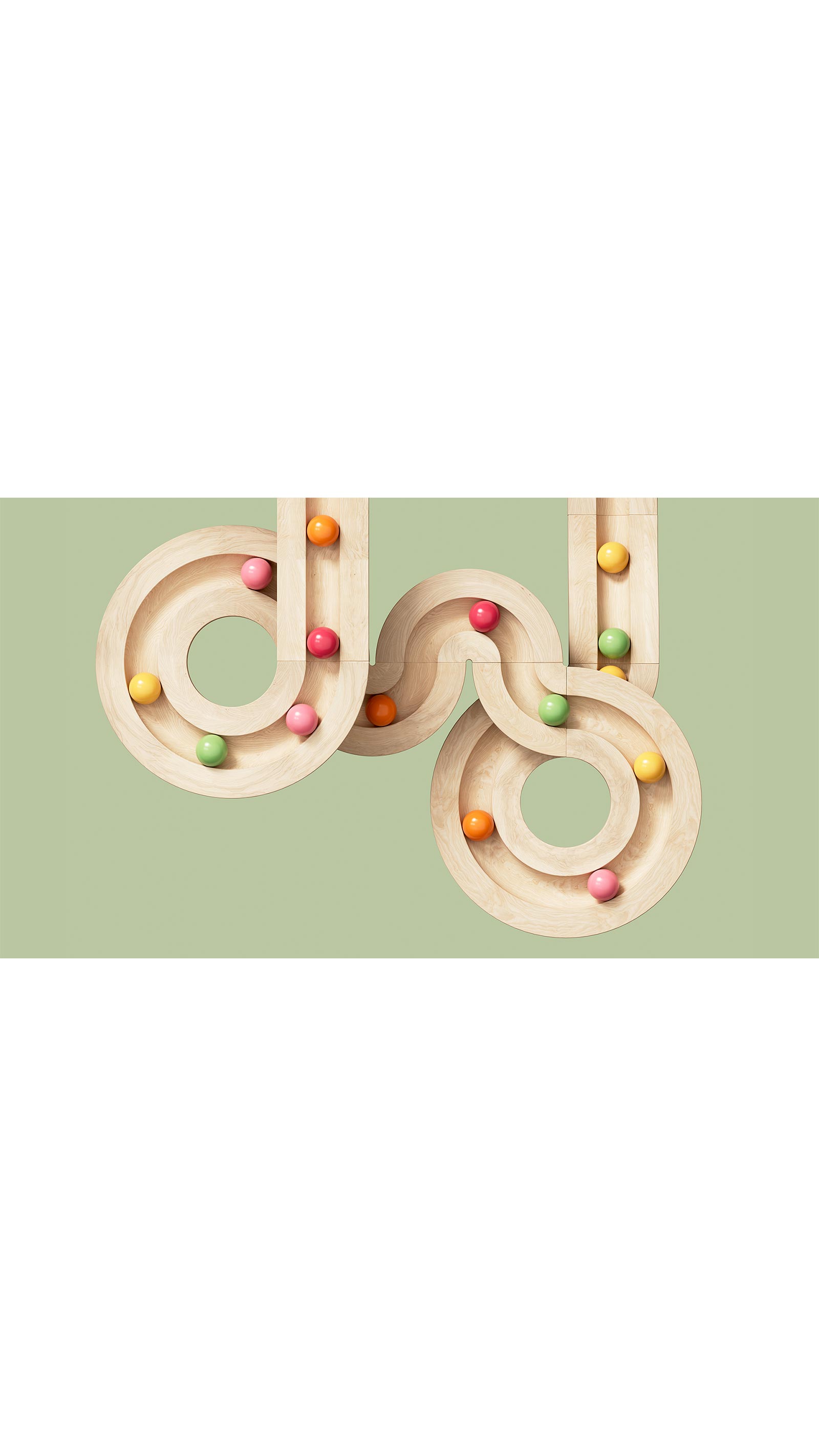 wooden toy colourful marbles racing on track in loops circles green background