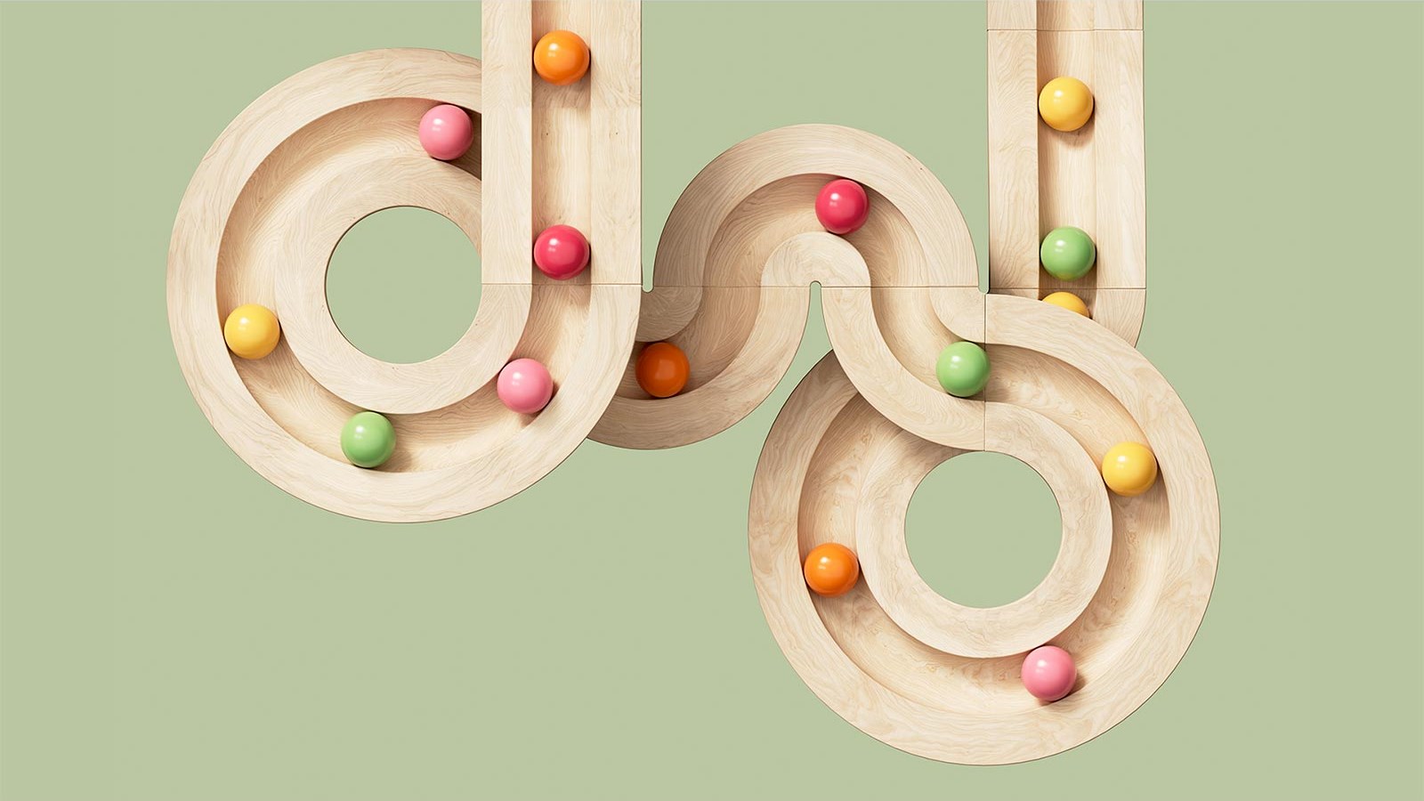 wooden toy colourful marbles racing on track in loops circles green background