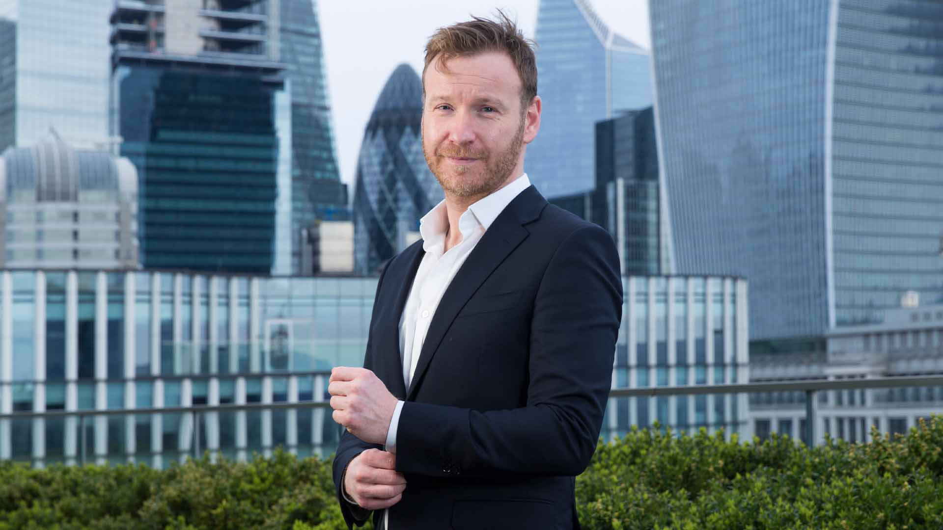 Ed Westhead, equity capital markets partner at Fieldfisher, London city skyline in background