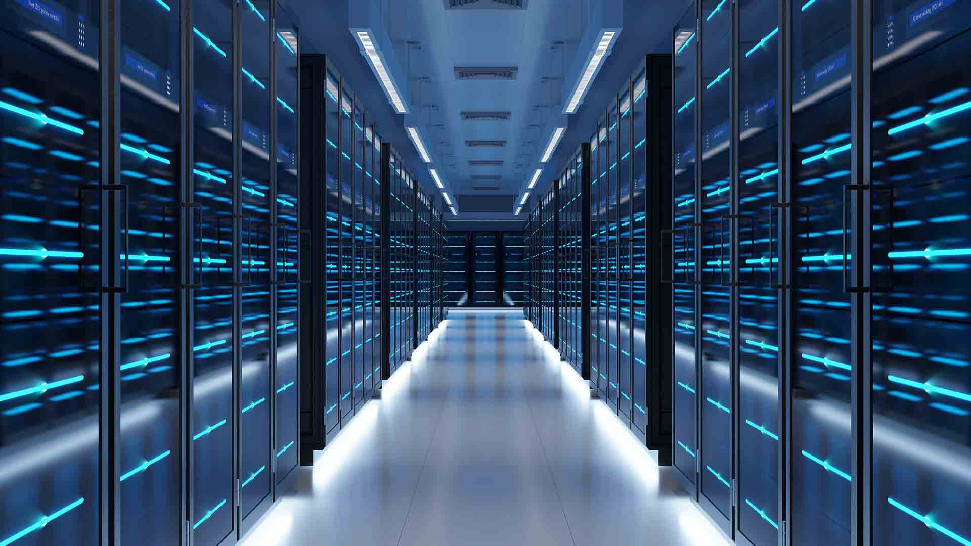 a long row of computer servers room blue lights behind glass doors