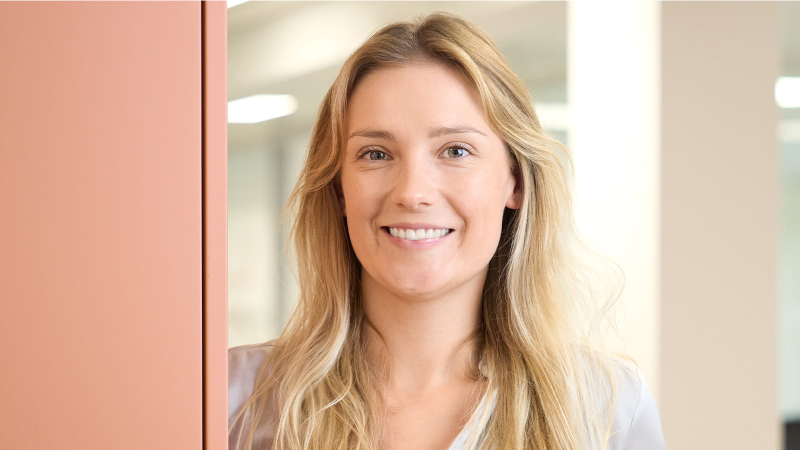 Millie Counsell, M&A executive, LAVA Advisory Partners. Young blonde woman corporate office