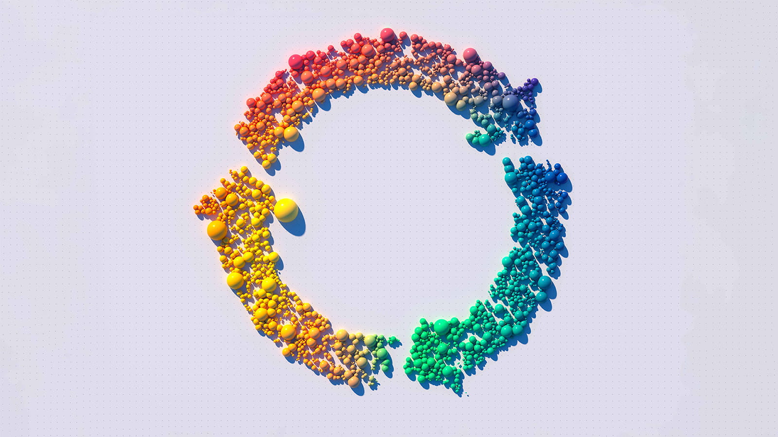 circle or three arrows formed of small colourful rainbow ombre balls