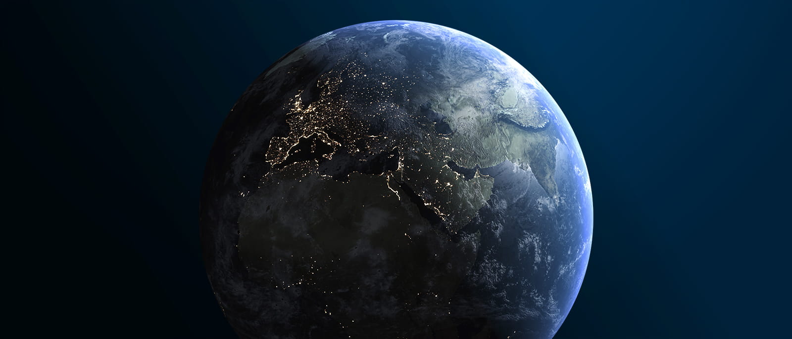 earth seen from space backlit by the sun day night city lights