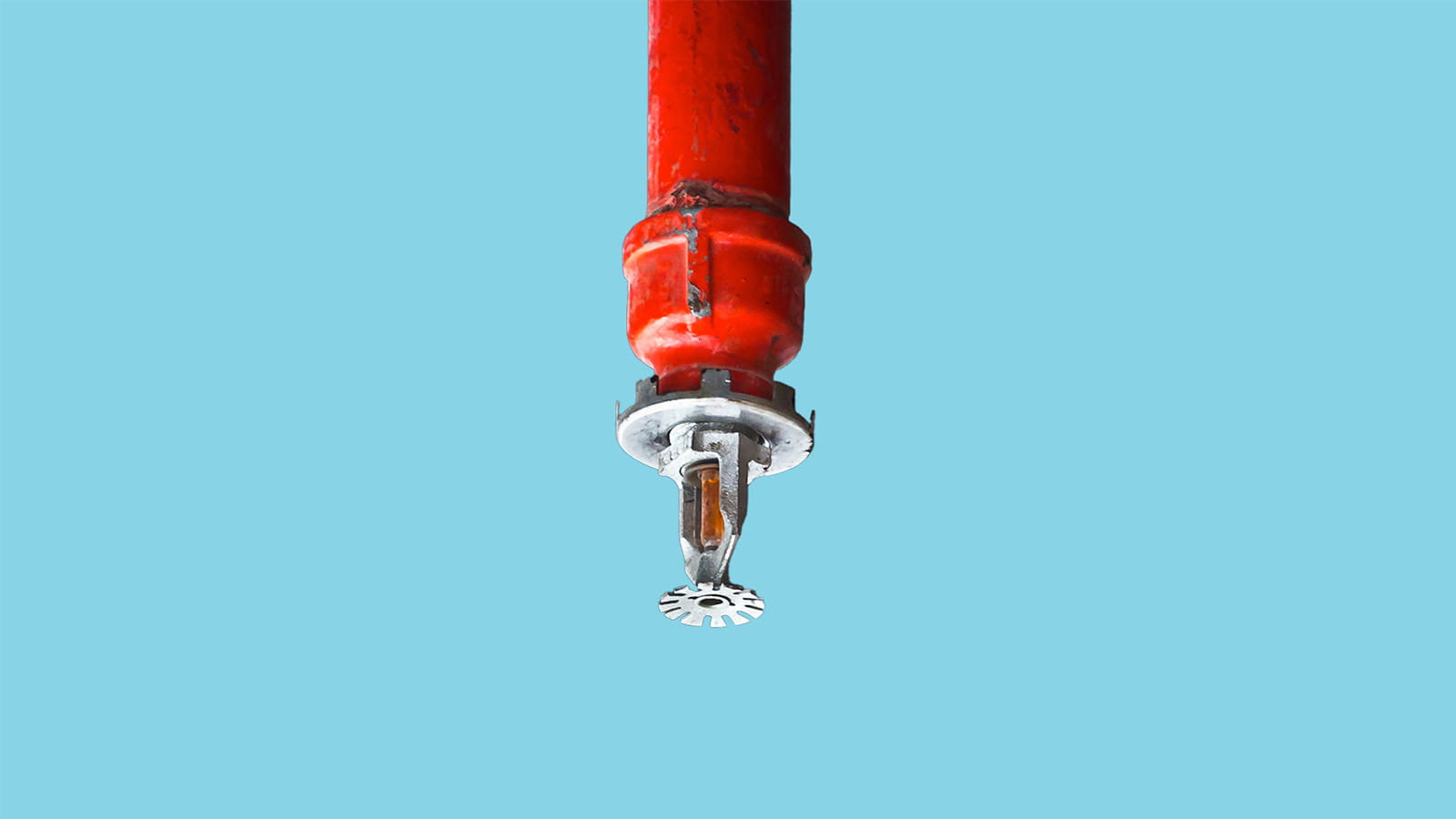 fire safety sprinkler red on a blue background