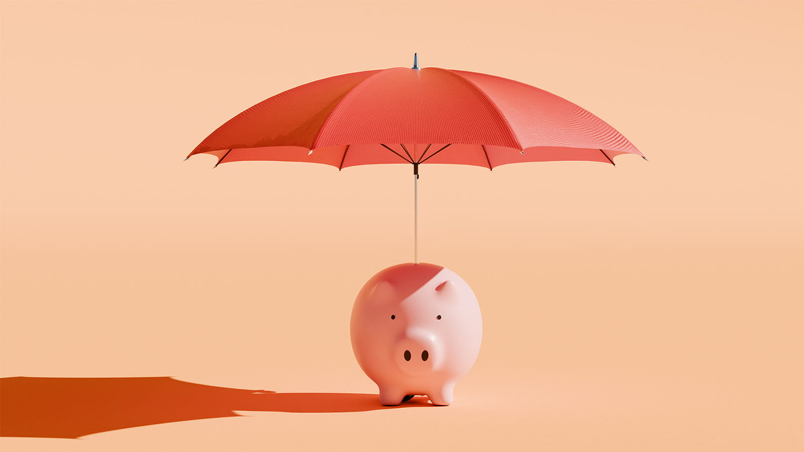 digital image of a piggy bank with a red umbrella above it on an orange background