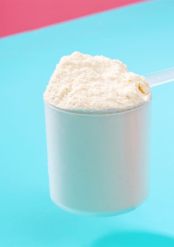 photo of a protein powder scoop blue pink