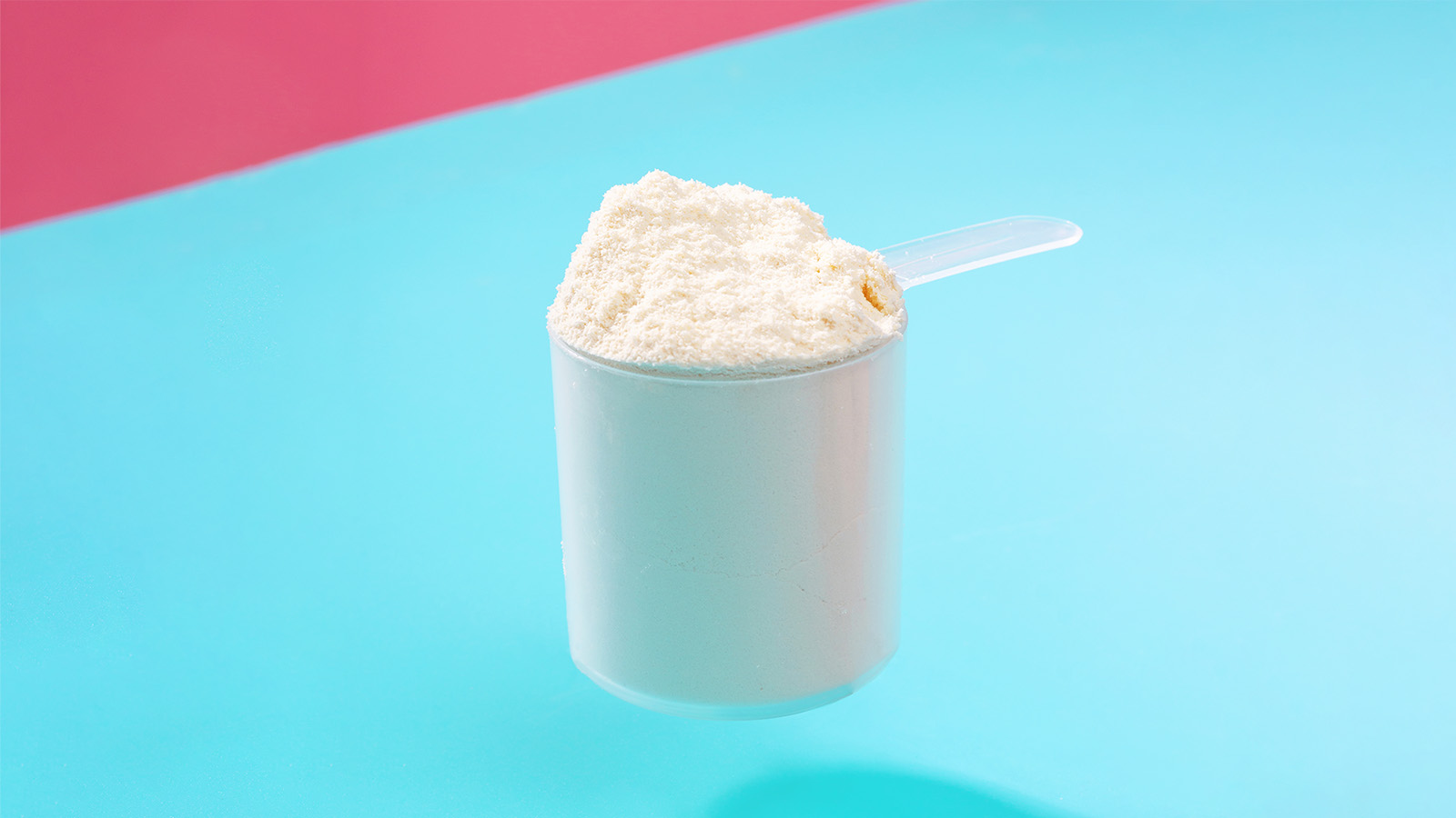 photo of a protein powder scoop blue pink