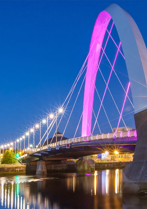 The Clyde Arc, Glasgow, Scotland, bridge arch city apartment building night lights