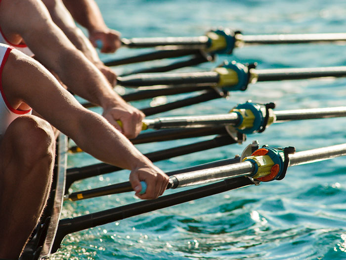 rowing team blue water river sport