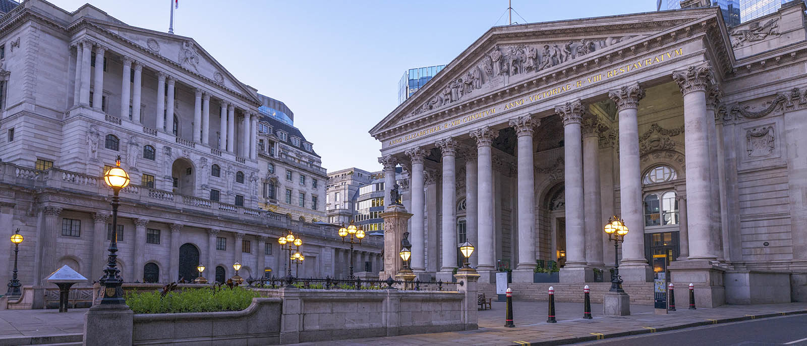 UK, empty street in London financial district with view of Bank of England and the Royal Exchange