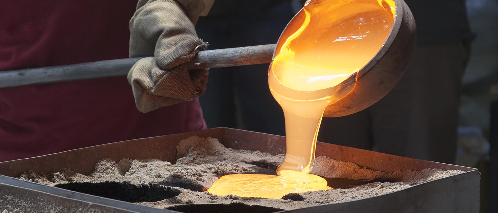 molten gold production pouring into mould refinery industrial