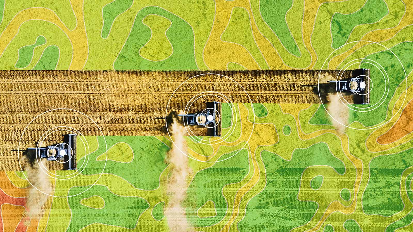 aerial photo of farming machinery ploughing land with a topical pattern