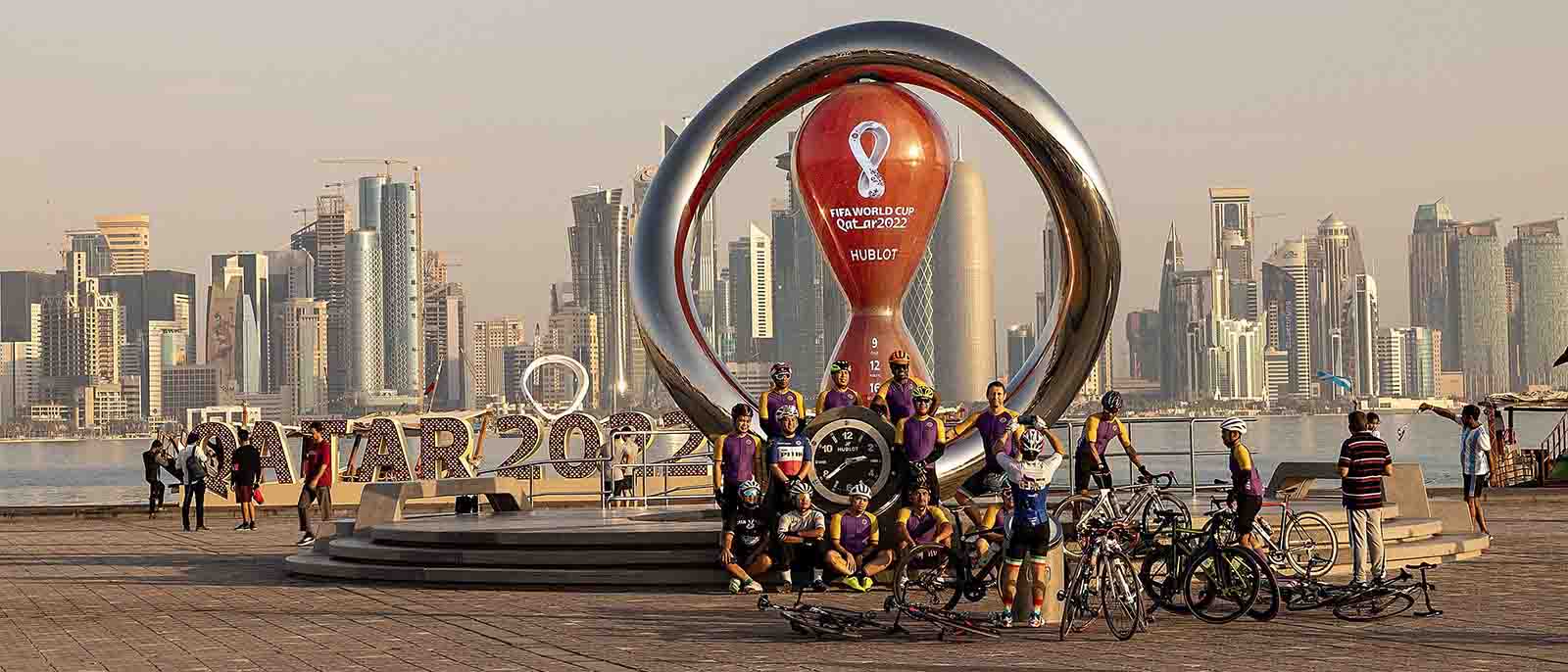 Doha, Qatar. 11th Nov, 2022. People take photos with the FIFA World Cup 2022 countdown clock near the corniche in Doha, Qatar