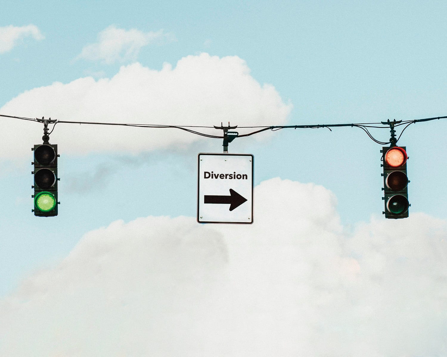 Calculating a new route cover art - red traffic light and one way sign below blue sky with clouds