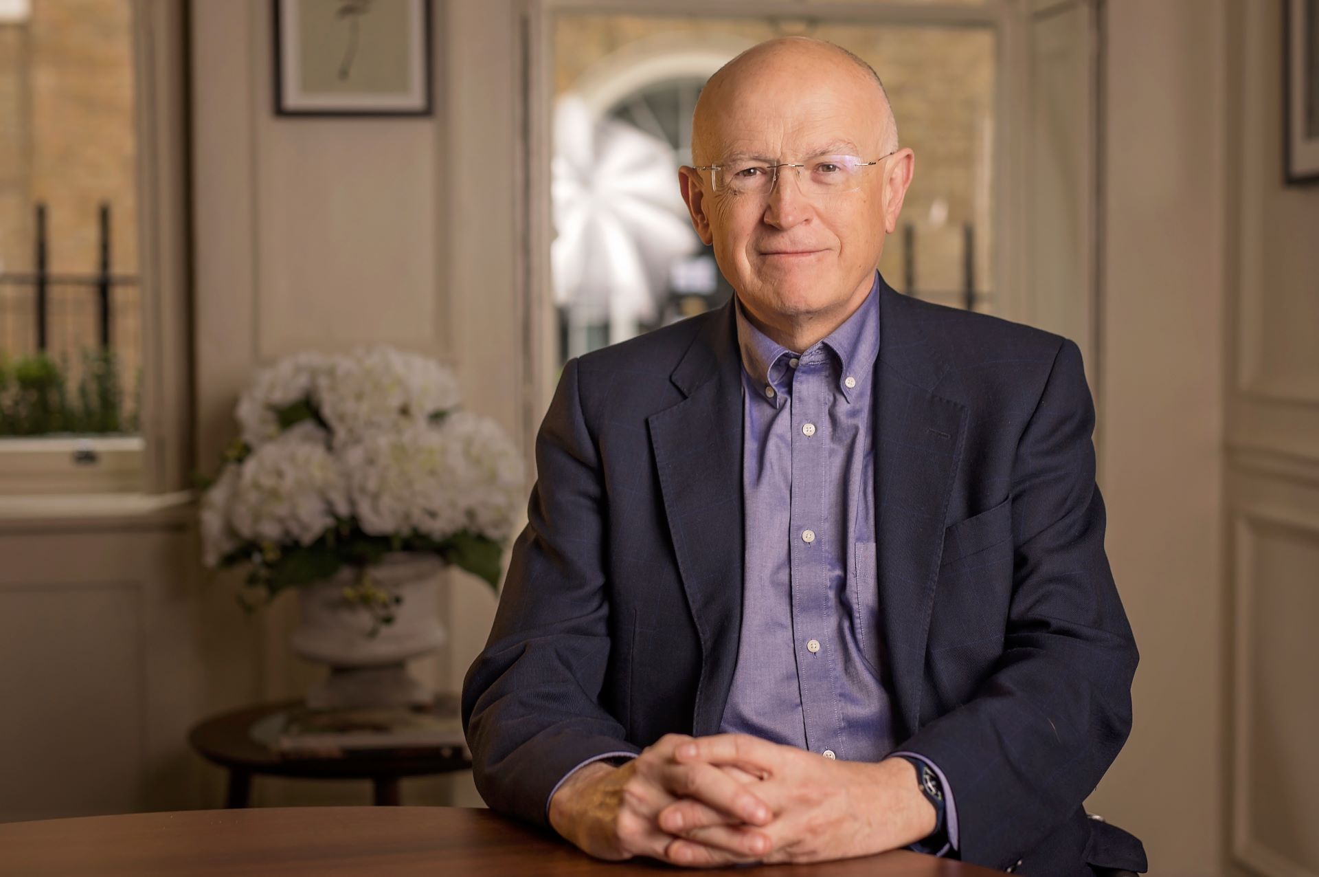 Jon Moulton sitting at a table