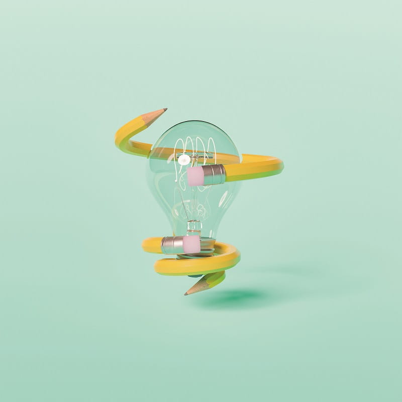 Lightbulb with a yellow pencil twisted around it