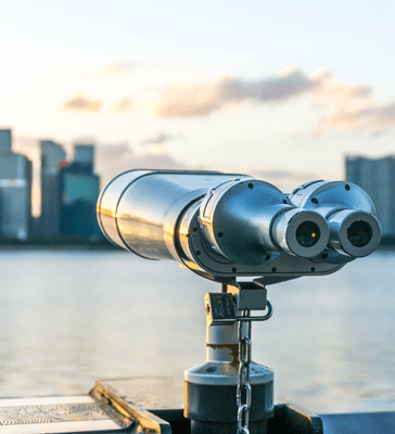 Telescope viewer with city skyline