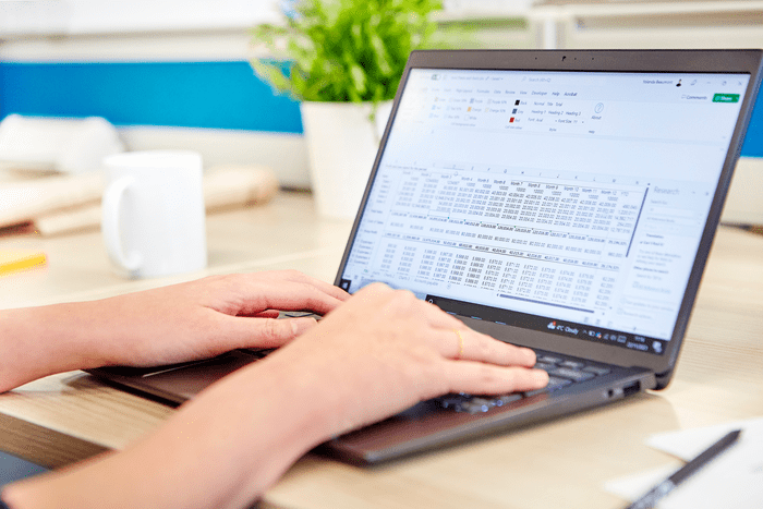 Close up of a hands typing on a laptop keyboard