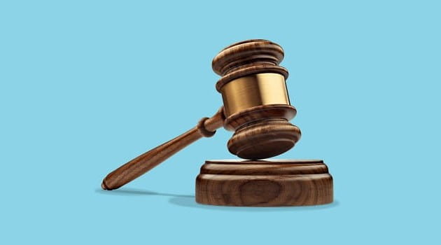 Gavel on a blue background