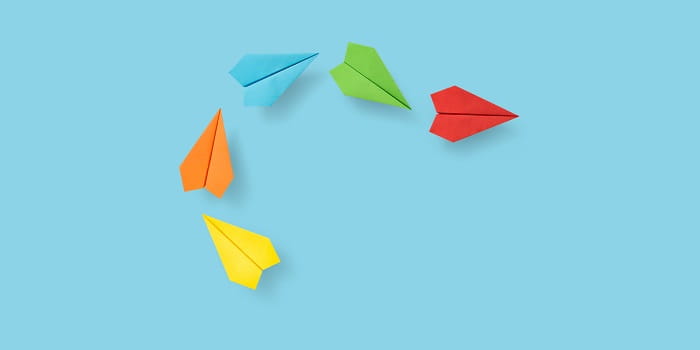 Paper planes on a blue background