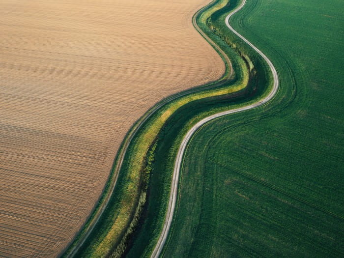 Landscape with road running through fields