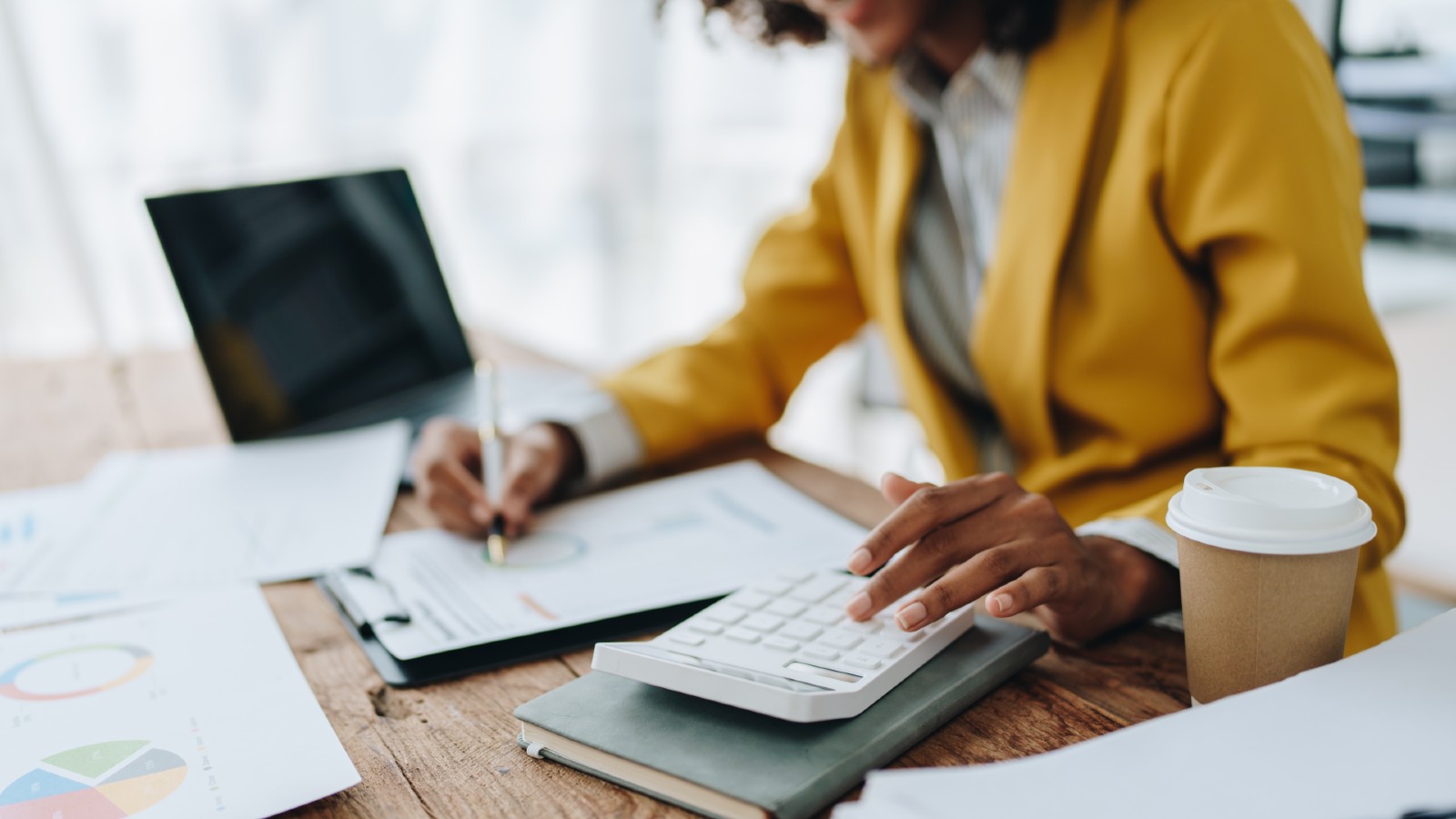 Woman doing admin tasks on her desk