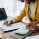 Woman doing admin tasks on her desk