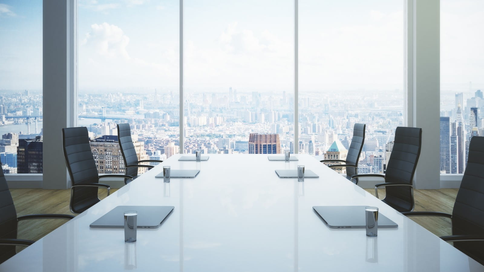 Empty boardroom with cityscape in background