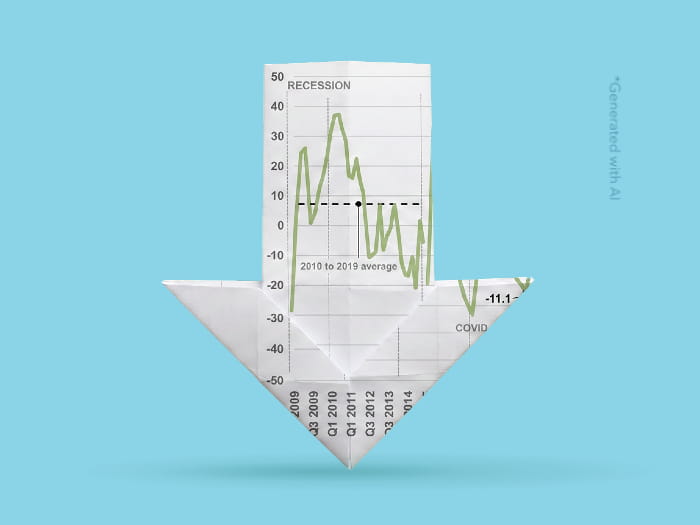 Origami downward arrow made from a financial chart against a blue background, symbolising declining performance or economic downturn.