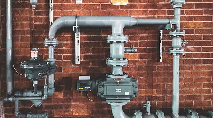 Pipework against a brick wall
