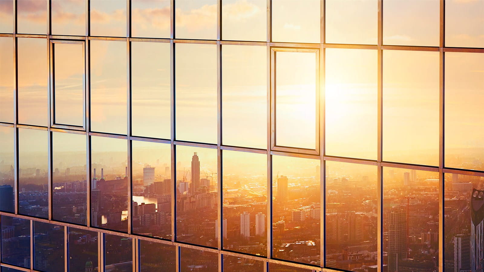 building new skyscraper window reflection sun sunset sunrise city ICAEW economy