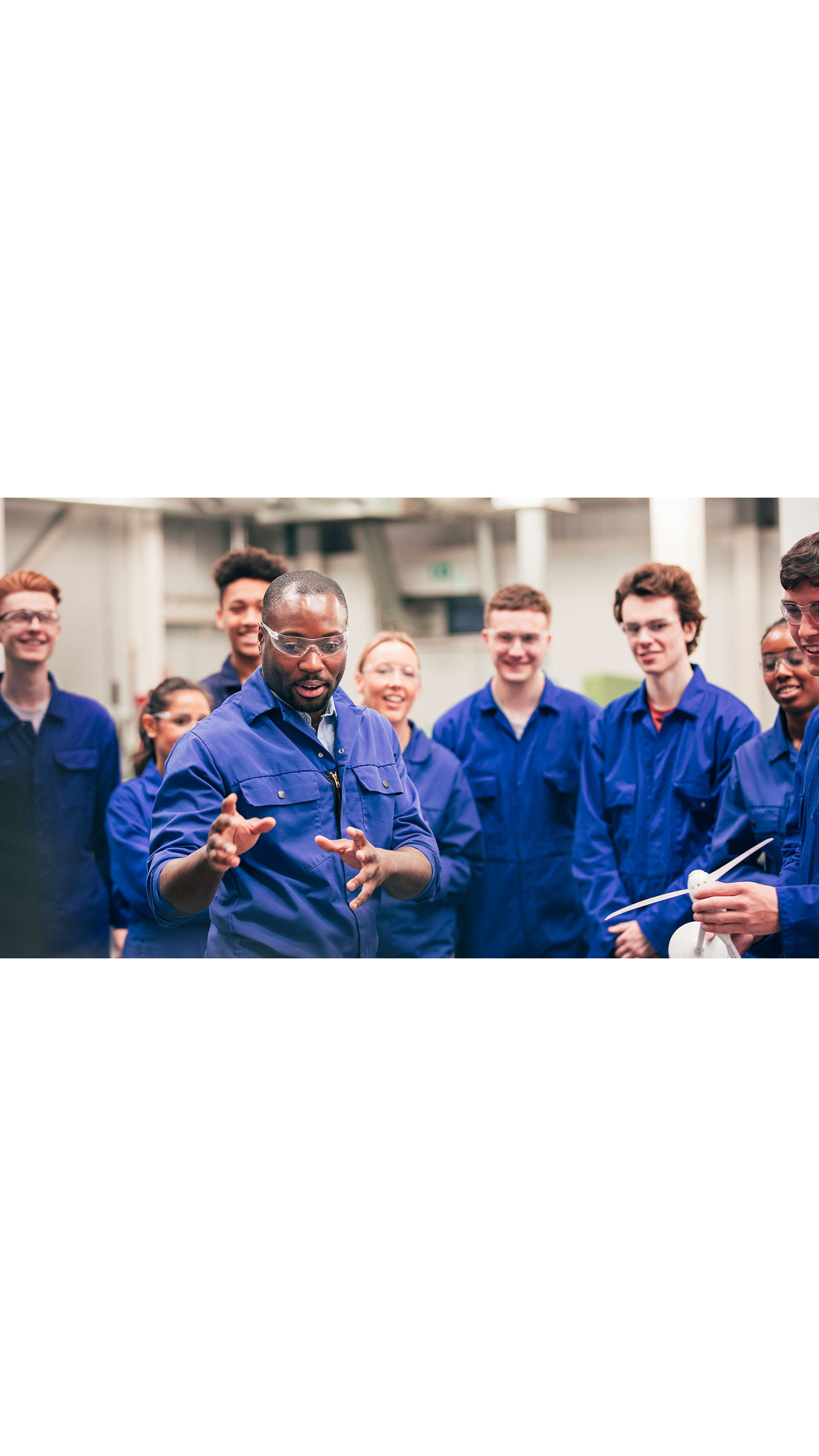 workers employees staff factory blue overalls training UK skills gap economy
