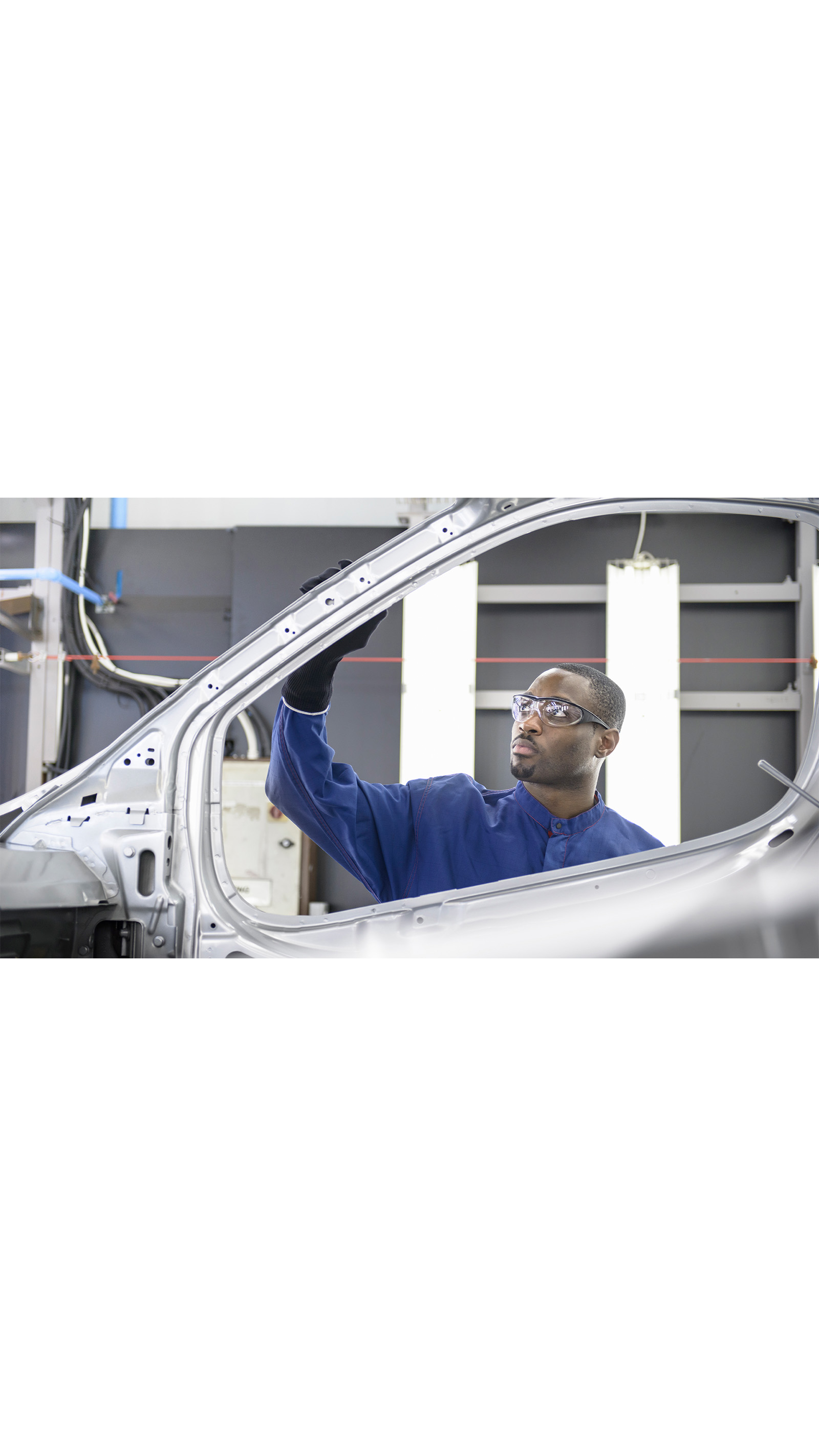 silver car auto factory assembly line man employee engineer ICAEW economy business